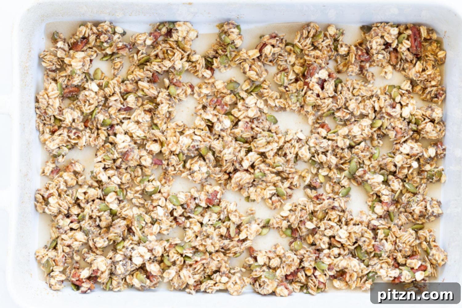This Date Caramel Maple Pecan Granola is lightly sweet and perfect for any time. Pecans, Oats, coconut, pumpkin and chia seeds and dried blueberries tossed in date caramel and baked to perfection. #Vegan #Granola #Glutenfree #Soyfree #Recipe #VeganRicha Can be nutfree.