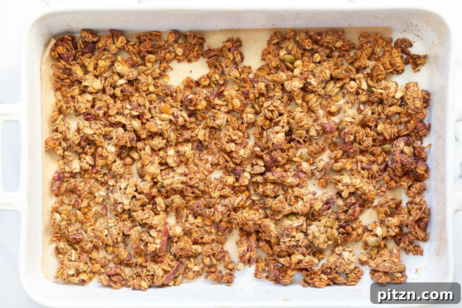 This Date Caramel Maple Pecan Granola is lightly sweet and perfect for any time. Pecans, Oats, coconut, pumpkin and chia seeds and dried blueberries tossed in date caramel and baked to perfection. #Vegan #Granola #Glutenfree #Soyfree #Recipe #VeganRicha Can be nutfree.
