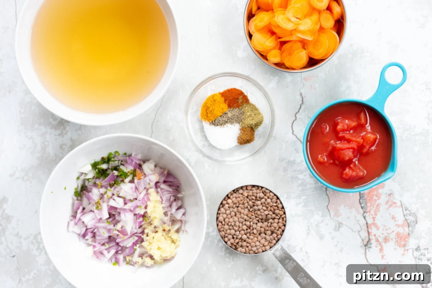 A collection of fresh, vibrant ingredients for our Vegan Lentil Soup, meticulously arranged in bowls. This showcases the quality components that go into making this easy, one-pot, 30-minute, gluten-free, soy-free, and nut-free plant-based meal. | VeganRicha.com