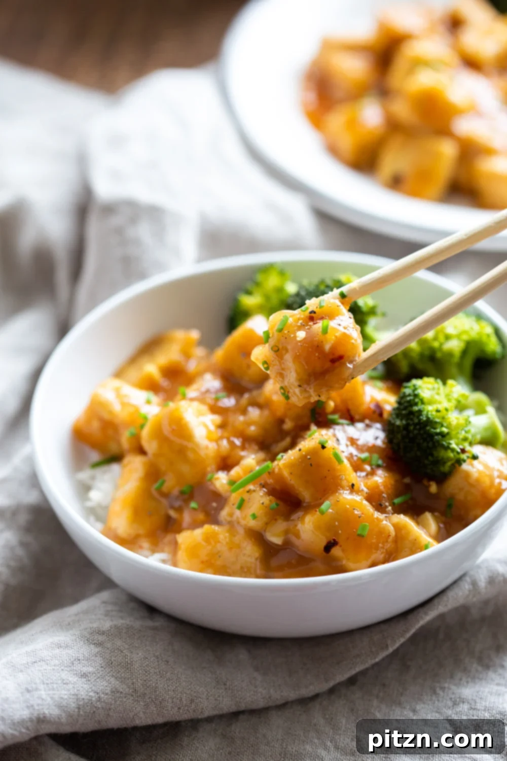 Zesty Vegan Orange Tofu 7 Easy Orange Tofu Recipe. Quick 30 Min Weeknight Meal. Baked Crisp Tofu with a Delicious Orange Sauce. Serve over rice/grains and with blanched broccoli or veggies. #Vegan #Glutenfree #Nutfree #OrangeTofu #Recipe #VeganRicha
