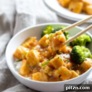 Zesty Vegan Orange Tofu 8 Delicious Easy Orange Tofu with a perfect glaze, served on a bed of rice with blanched broccoli.