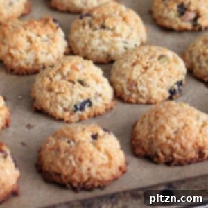 Tropical Zest Macaroons: Cranberry Pistachio Dream (Gluten-Free, Vegan) 2 A close-up of a Zesty Coconut Macaroon, showing its golden-brown exterior and delicious texture.