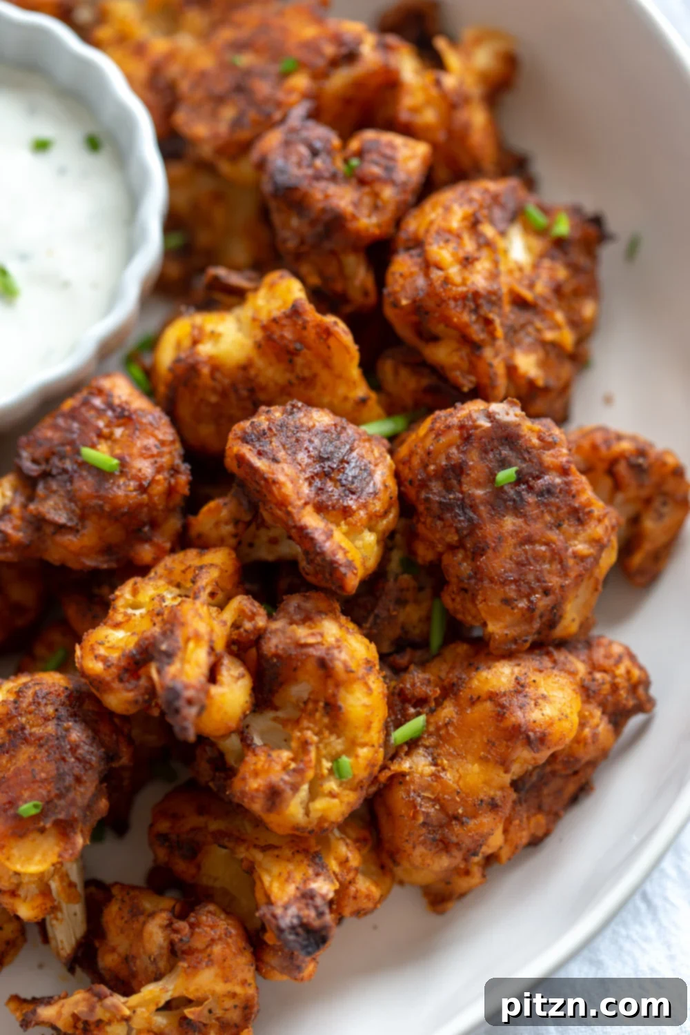 Crispy Vegan Nashville Hot Cauliflower Bites, served hot and delicious with vegan ranch, perfect for wraps or bowls. A flavorful plant-based recipe that's nut-free, soy-free, and offers a gluten-free option.