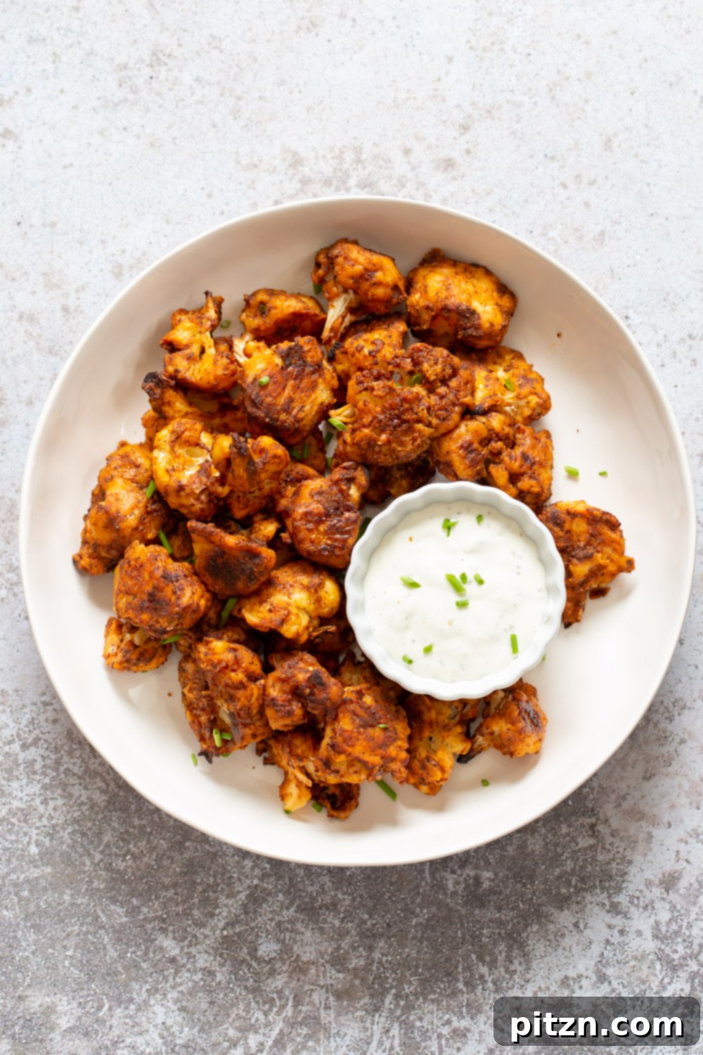 Delicious Vegan Nashville Hot Cauliflower Bites, seasoned and ready to be served as flavorful plant-based wings. A versatile recipe that's nut-free, soy-free, and gluten-free adaptable.