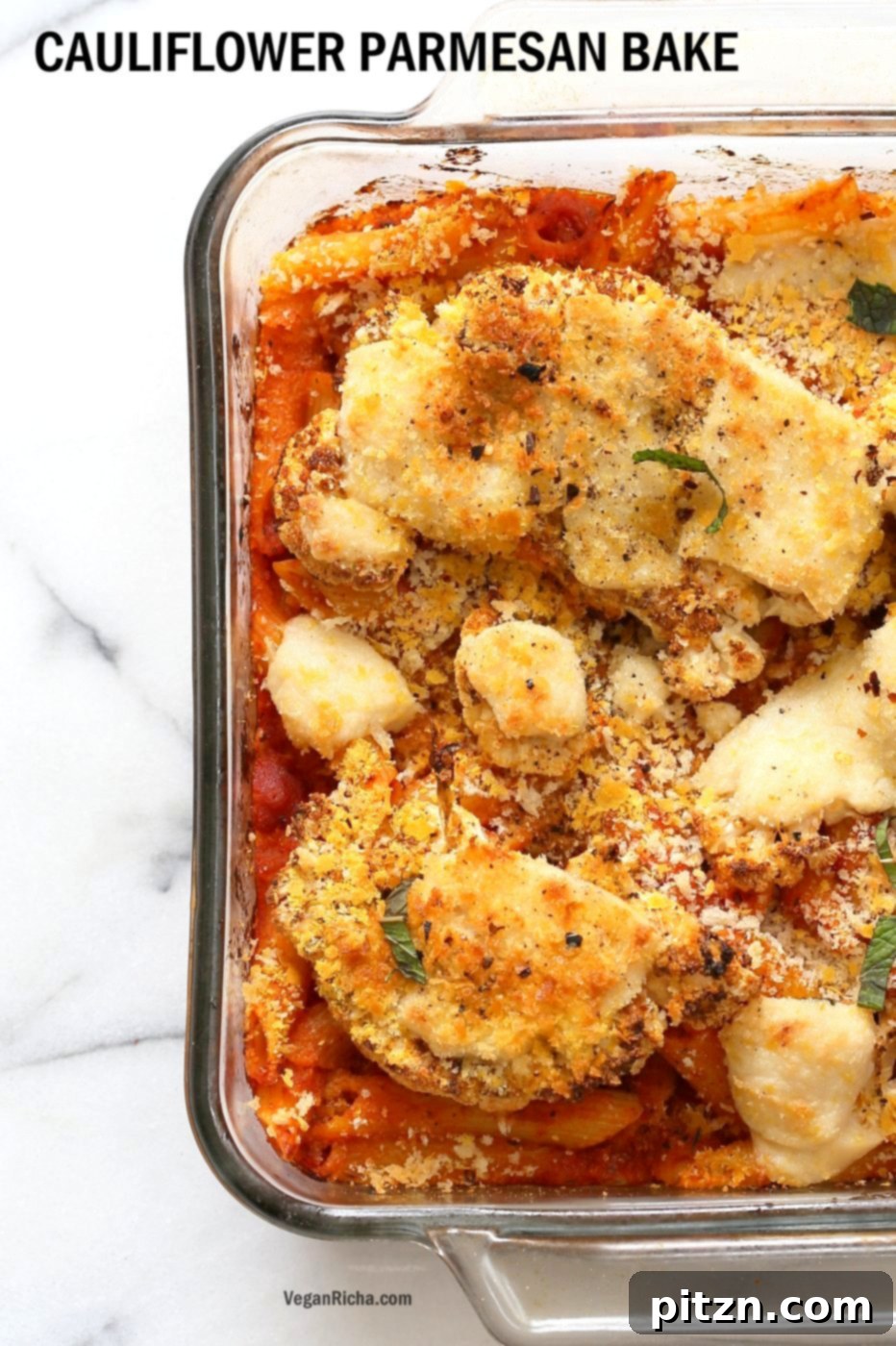 Vegan Cauliflower Parmesan Pasta Bake. Tender breaded cauliflower slices baked and layered over a comforting pasta and tomato sauce casserole.