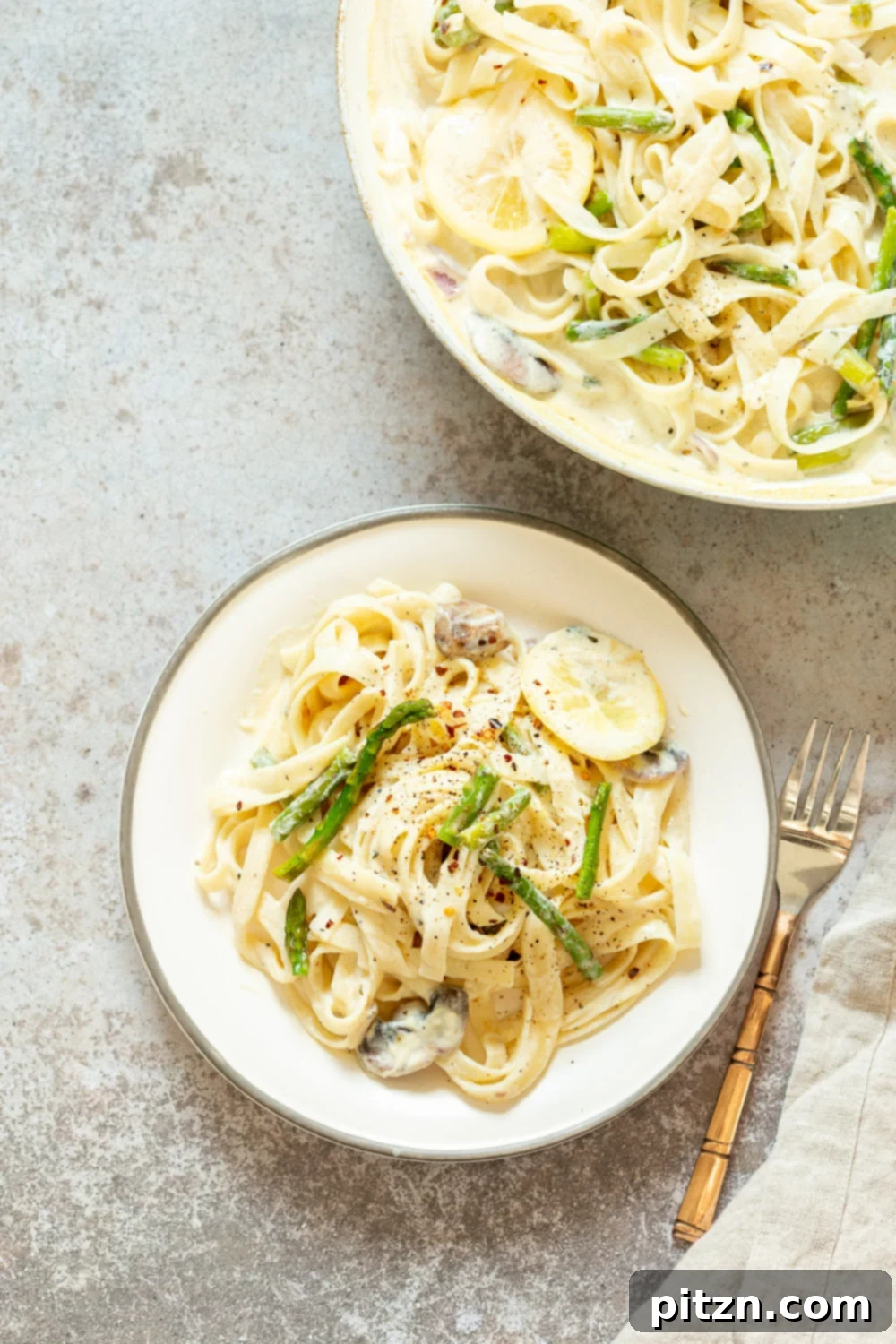 30 Minute Vegan Lemon Asparagus Pasta 2 Vegan Lemon Asparagus Pasta - 30 mins! Creamy Lemon Alfredo style sauce with tofu with fettuccine and pan roasted garlic asparagus and more lemon. #Vegan #Nutfree #Recipe. Can be Glutenfree #VeganRicha #LemonAsparagusPasta 17 gm of protein
