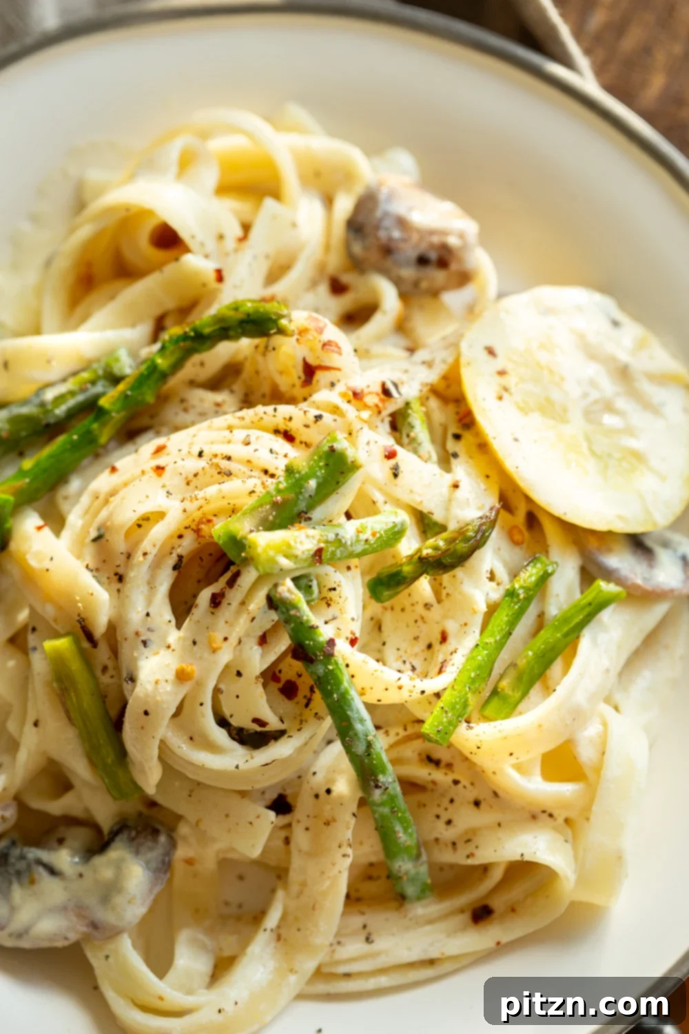 30 Minute Vegan Lemon Asparagus Pasta 12 Vegan Lemon Asparagus Pasta - 30 mins! Creamy Lemon Alfredo style sauce with tofu with fettuccine and pan roasted garlic asparagus and more lemon. #Vegan #Nutfree #Recipe. Can be Glutenfree #VeganRicha #LemonAsparagusPasta 17 gm of protein