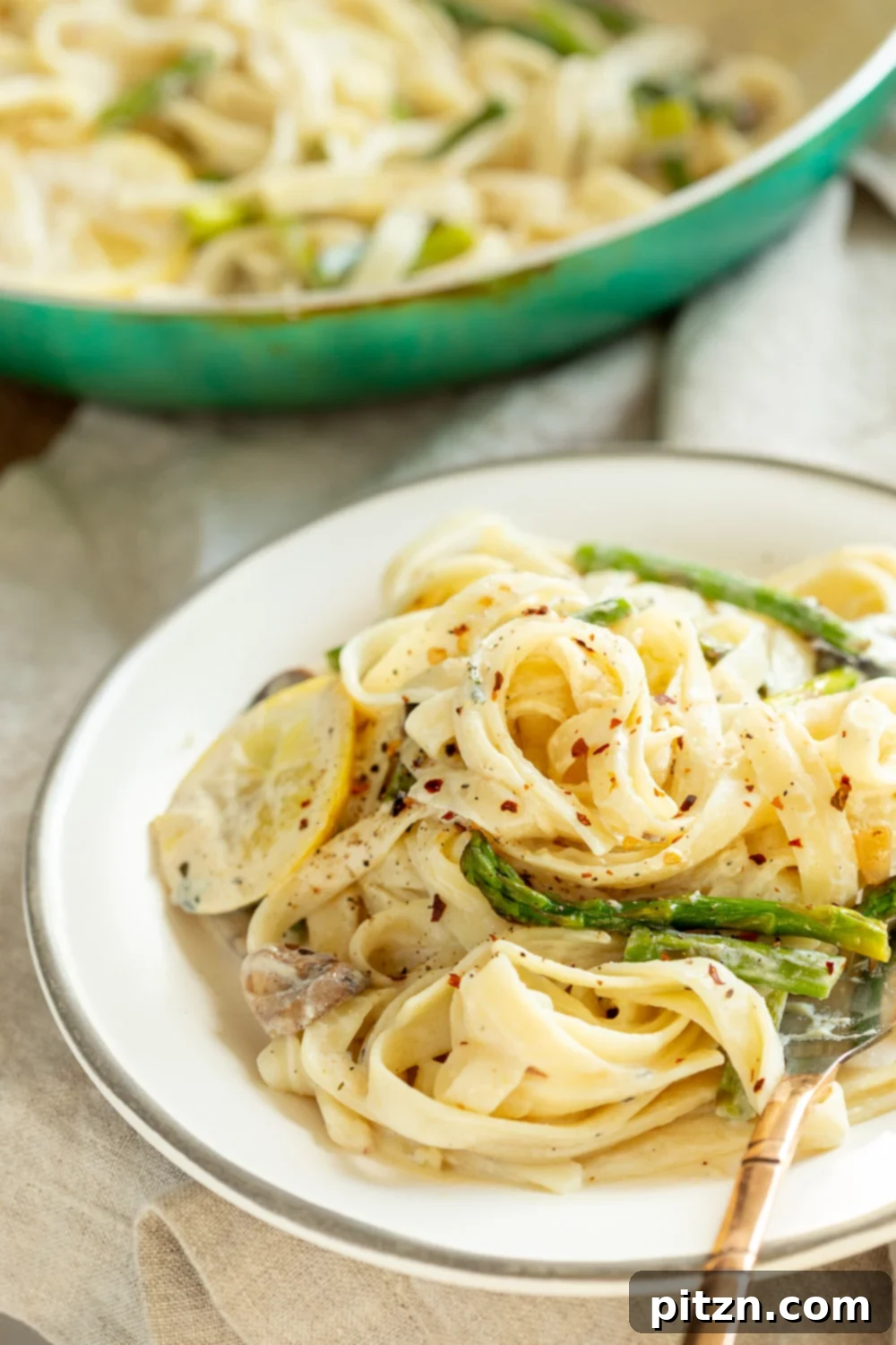 30 Minute Vegan Lemon Asparagus Pasta 13 Vegan Lemon Asparagus Pasta plated on a white plate kept over linen napkin #Veganricha