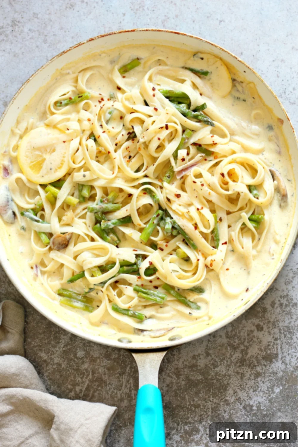 30 Minute Vegan Lemon Asparagus Pasta 3 Vegan Lemon Asparagus Pasta - 30 mins! Creamy Lemon Alfredo style sauce with tofu with fettuccine and pan roasted garlic asparagus and more lemon. #Vegan #Nutfree #Recipe. Can be Glutenfree #VeganRicha #LemonAsparagusPasta 17 gm of protein