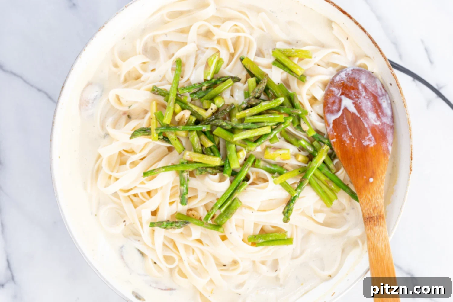 Vegan Lemon Asparagus Pasta - 30 mins! Creamy Lemon Alfredo style sauce with tofu with fettuccine and pan roasted garlic asparagus and more lemon. #Vegan #Nutfree #Recipe. Can be Glutenfree #VeganRicha #LemonAsparagusPasta 17 gm of protein