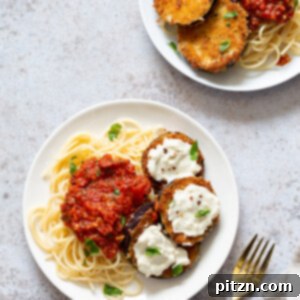 Vegan Eggplant Parmesan served with spaghetti