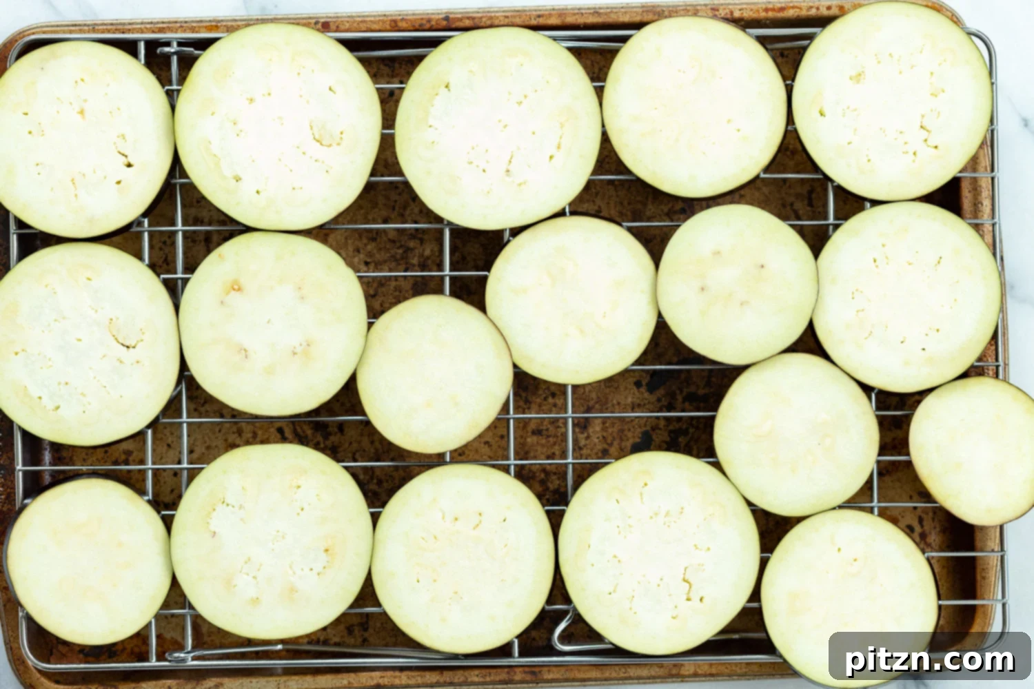 Simple Vegan Eggplant Parmesan 10 Salted eggplant slices draining on a wire rack