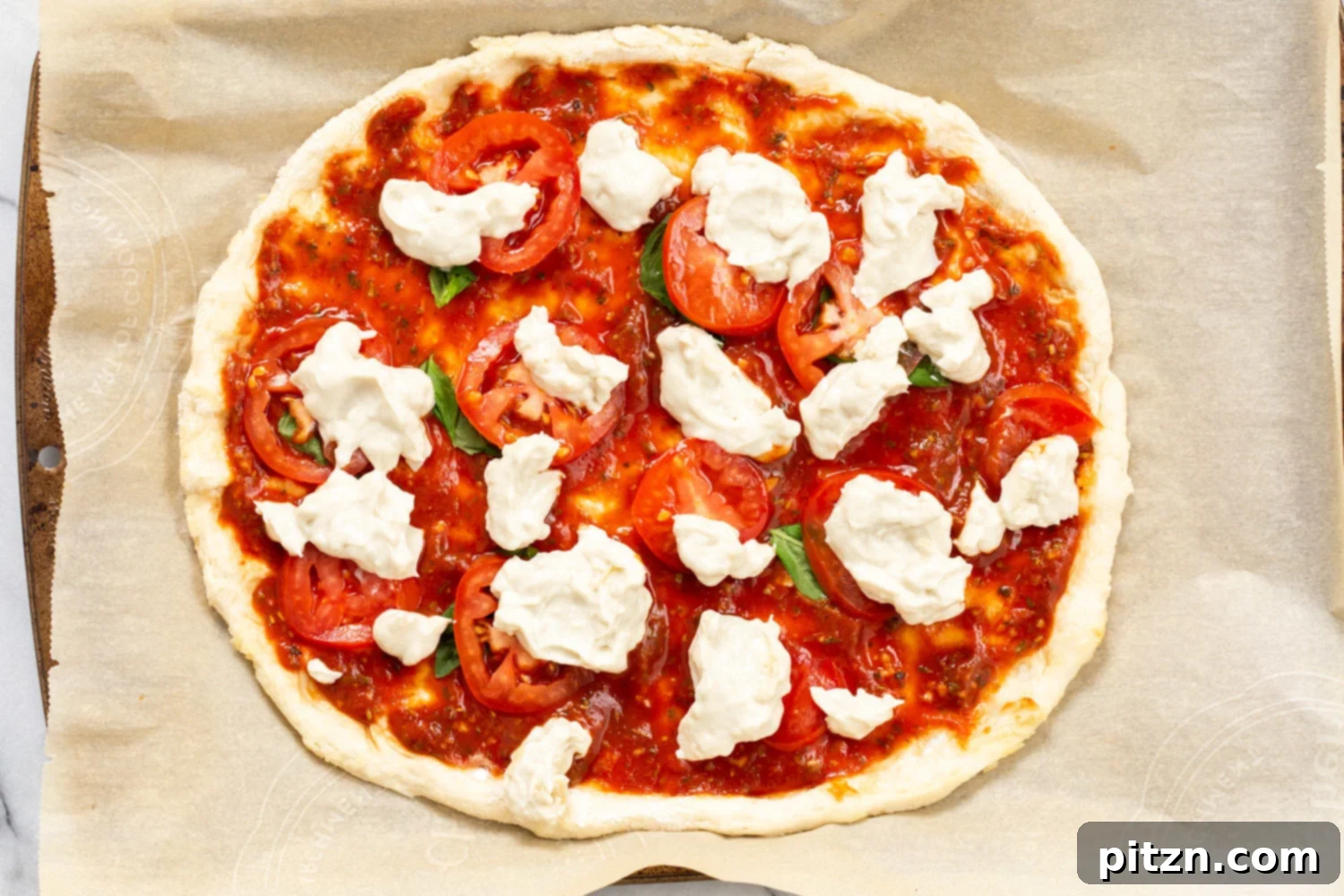 Our Vegan Margherita Pizza on parchment