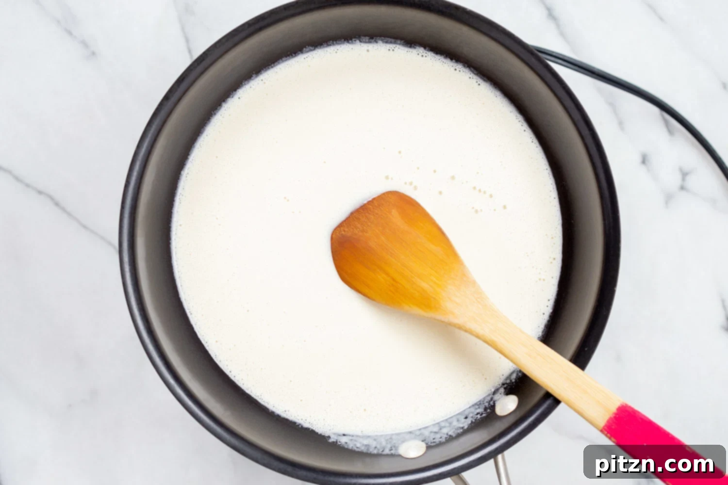 Cashew Mozzarella in skillet for our vegan Margherita pizza 