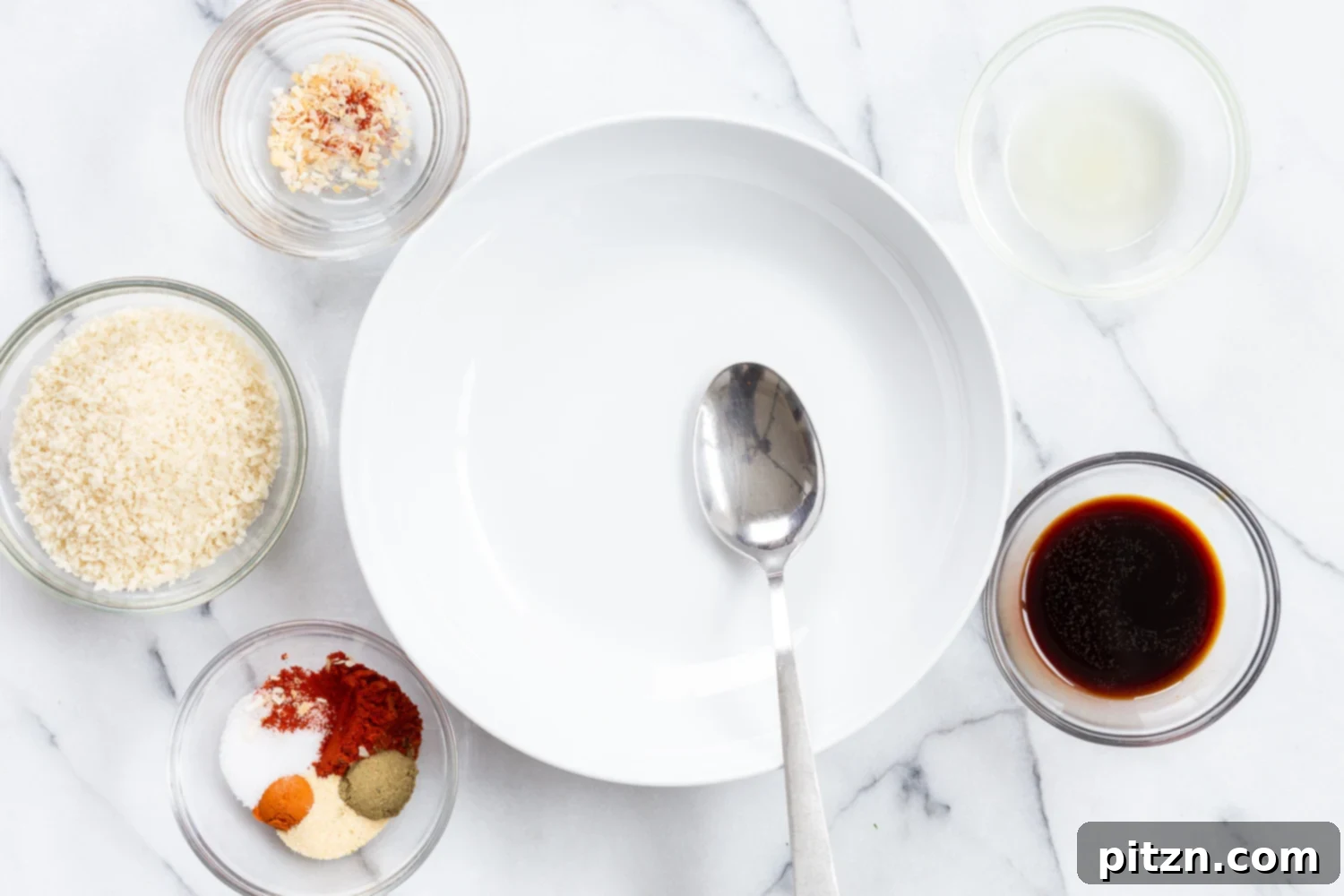 Ingredients for the tofu marinade laid out in small bowls, including soy sauce, spices, and lime.