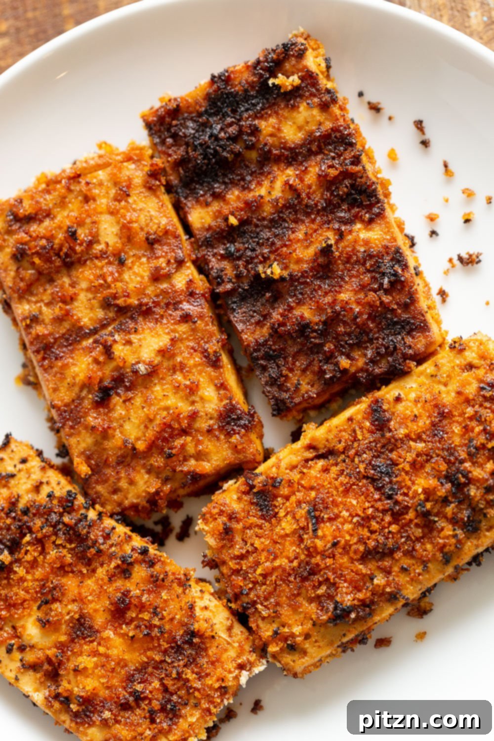 Perfectly crispy breaded tofu, golden brown and ready to be served, showcasing a delightful crunch.
