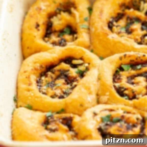 Vegan Pizza Rolls. Easy Pizza dough stuffed with herbed mushroom tomato filling, rolled, sliced and baked. Delicious snack or appetizer! #Vegan #Soyfree #Nutfree #Recipe #Veganpizzarolls #VeganRicha