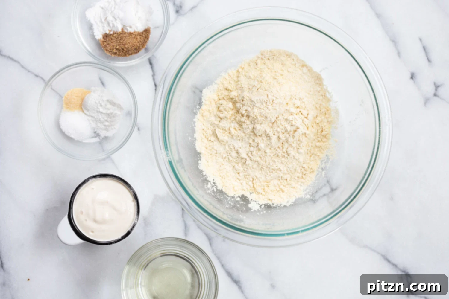 Delicious Vegan Grain-Free Naan 5 Bowls of dry ingredients for Vegan Grainfree Gluten Free Naan, including chickpea flour, flaxseed meal, starch, and spices