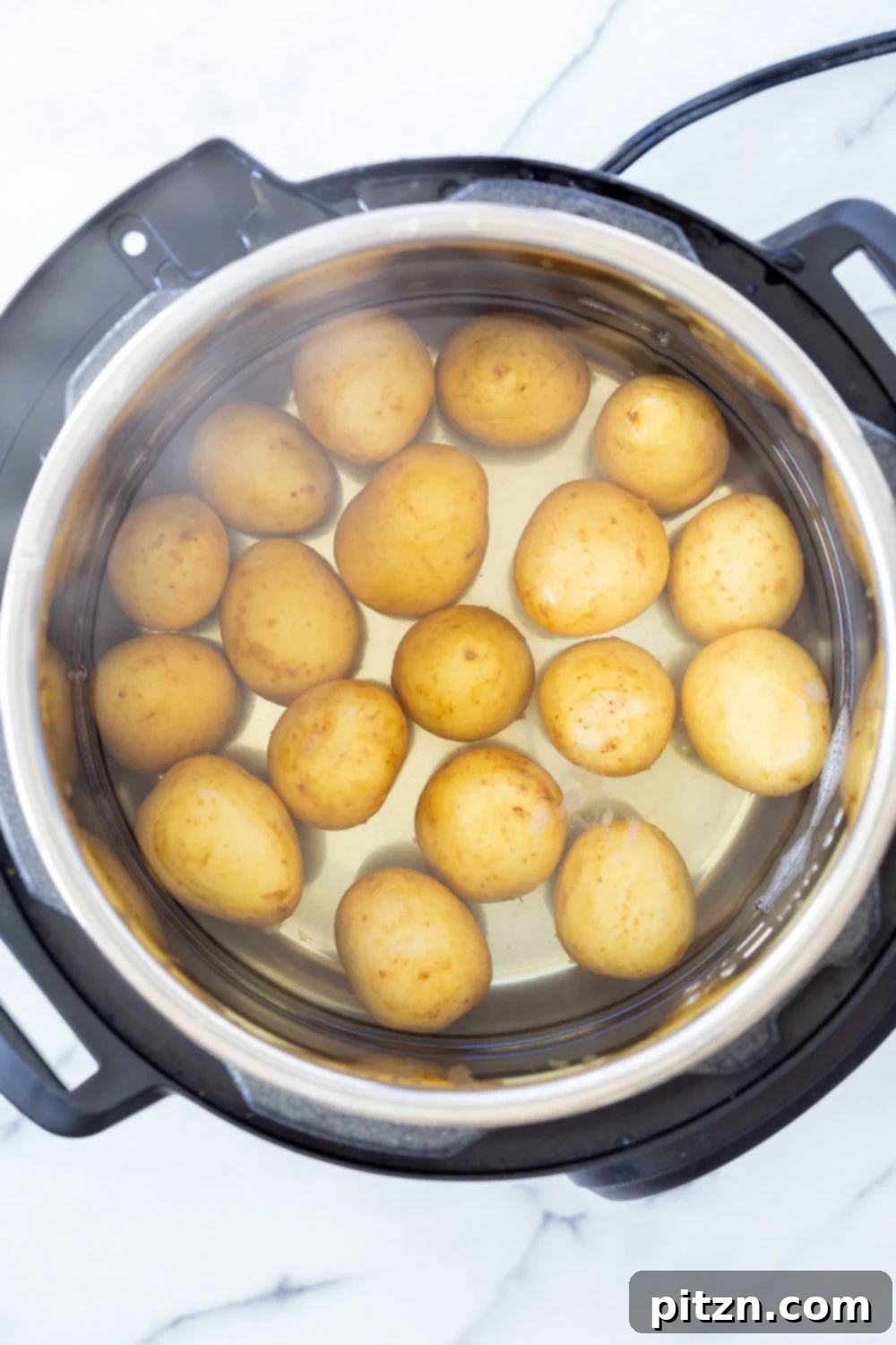 Potatoes cooked in Instant Pot for our Crispy Vegan Smashed Potatoes with Chimichurri.