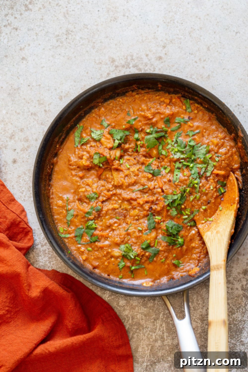 Vegan Keema Madras on a black skillet, garnished with fresh cilantro, ready to be served.