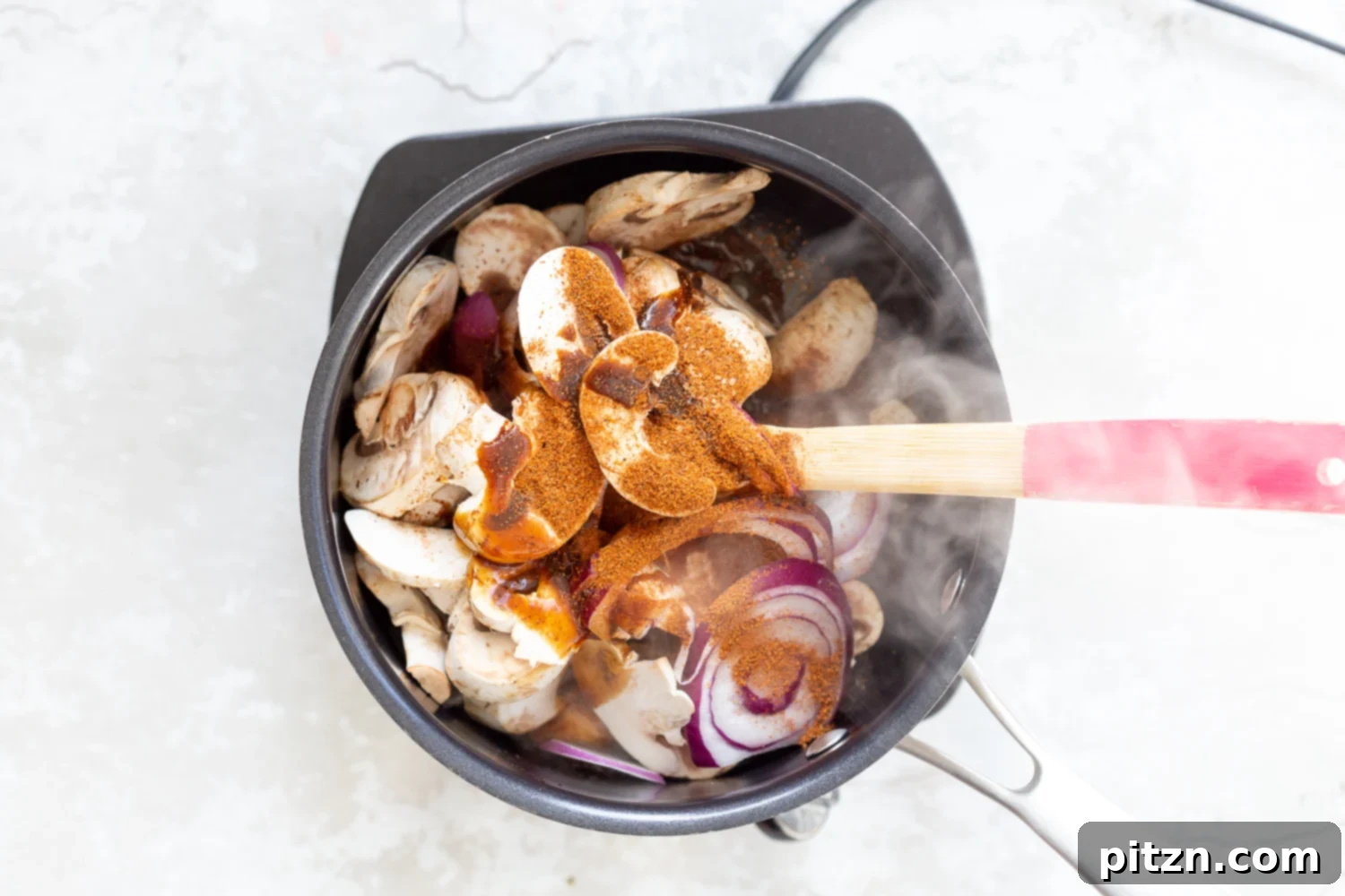Mushrooms and shawarma spice mixture ready in a saucepan for cooking, forming the flavorful base of our Vegan Mushroom Gyro.