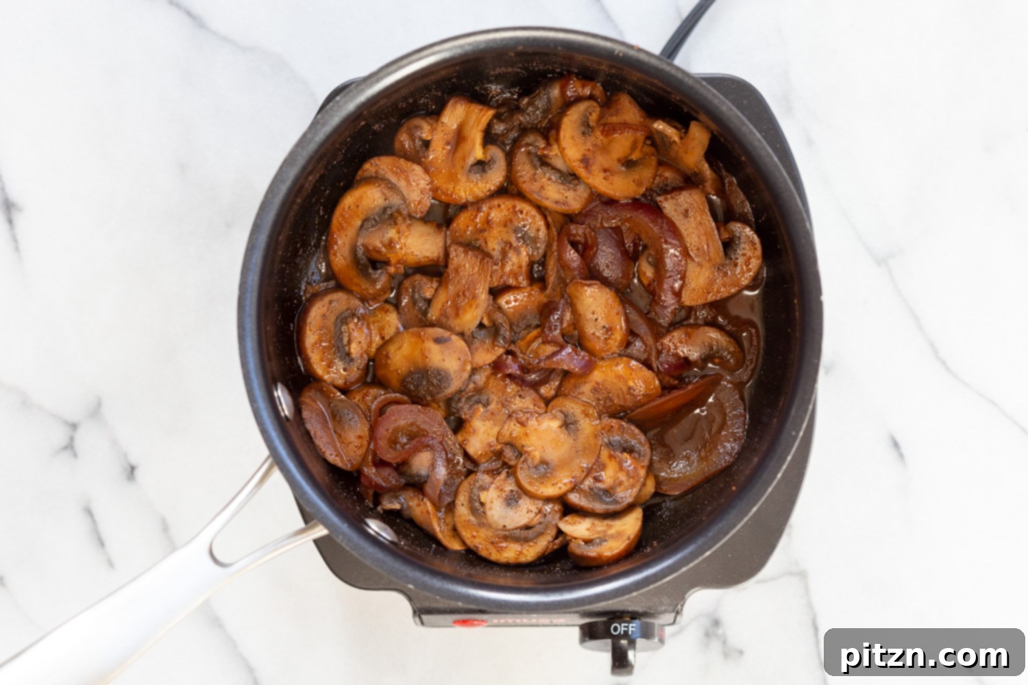 Mushrooms and sauce simmering in a saucepan for our Vegan Gyros, developing rich flavors.