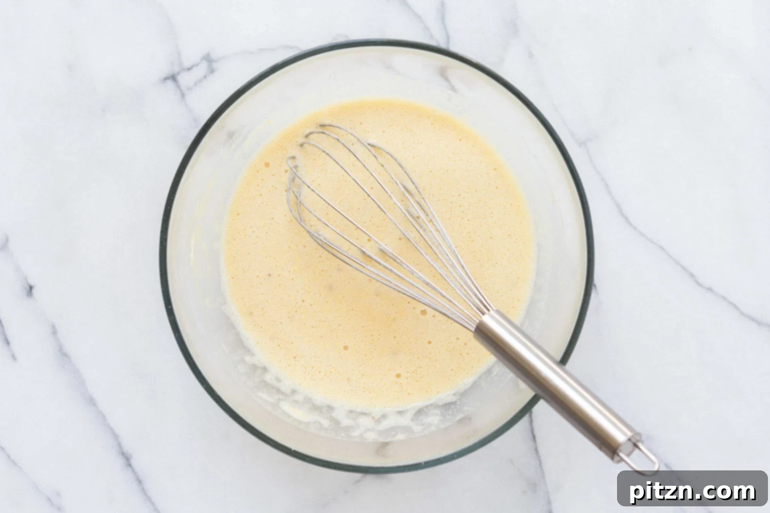 Chickpea Flour Batter in a glass bowl for our Vegan Socca