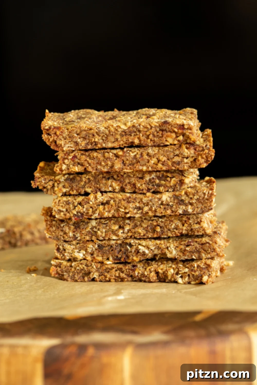vegan granola bars side view of a stack of vegan caramelized banana granola bars