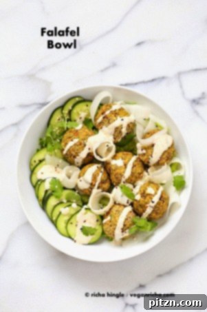 26 Vibrant Vegan Bowl Recipes 18 A vibrant bowl of lentil falafel served with fresh vegetables and a creamy tahini garlic dressing, offering a quick and easy vegan meal solution.