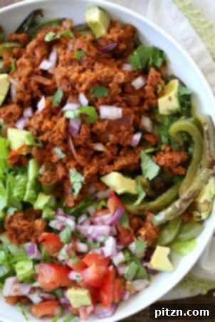 Vegan Taco Salad Bowl with Carrot Walnut Taco "Meat". A meatless taco salad featuring a flavorful carrot walnut taco filling. Easily made into a wrap or tacos. Vegan, Gluten-free recipe.
