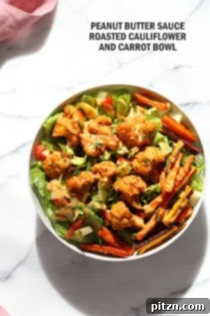 26 Vibrant Vegan Bowl Recipes 10 A vibrant and colorful vegan bowl, likely featuring roasted vegetables and a rich sauce, perfectly composed for a nourishing and satisfying meal.