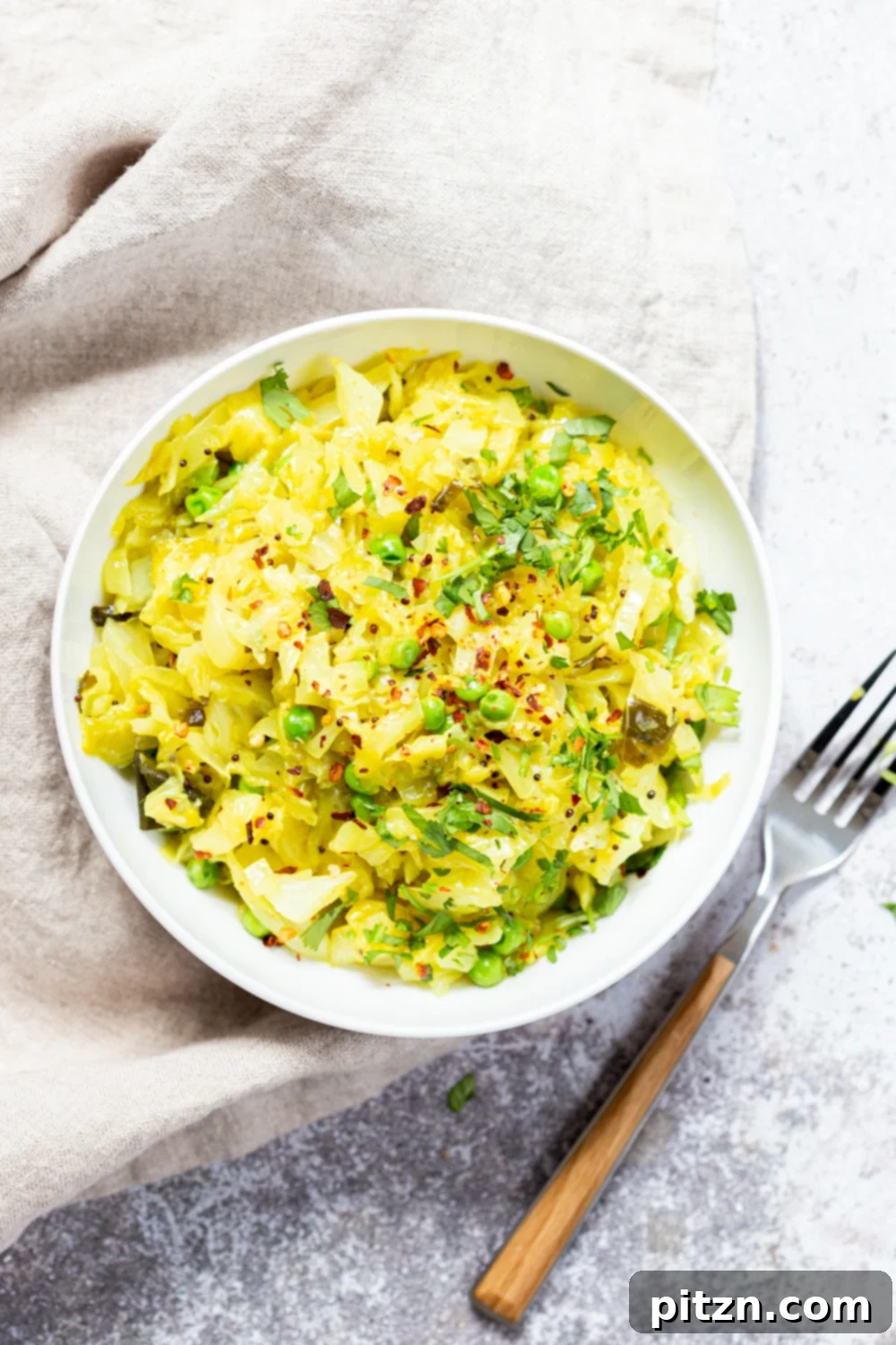A second beautiful shot of Instant Pot Indian Cabbage and Peas in a white bowl, showcasing its appetizing texture and vibrant colors.