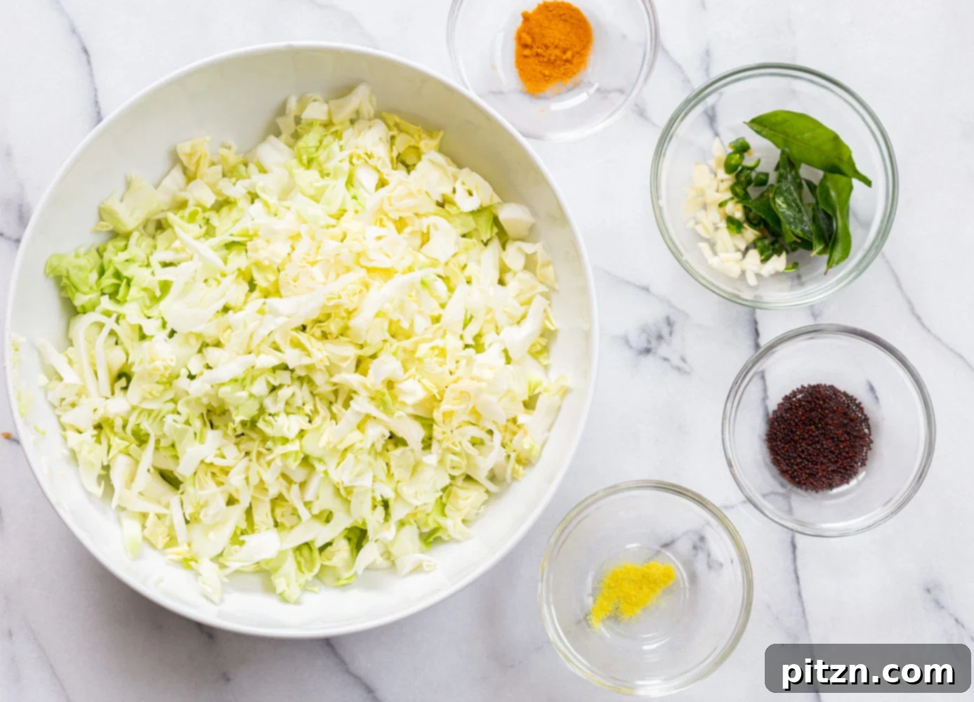 Bowls of prepped ingredients for Indian Cabbage and Peas, including chopped cabbage, peas, and various spices.