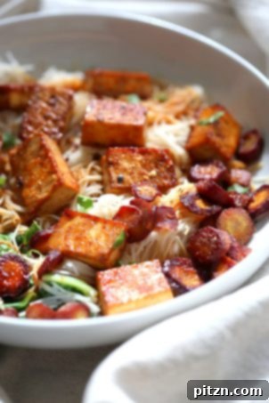 Baked Chili Garlic Tofu, Carrot, Chard and Noodle Bowls. An easy weeknight meal, garnished with toasted cashews and other veggies. Gluten-free, nut-free, vegan recipe. | VeganRicha.com