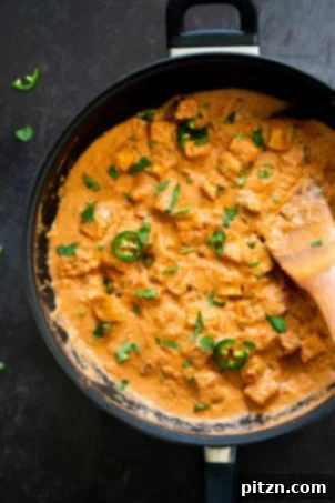 Tofu Transformed: Stir-fries, Marinades, Curries, Sandwiches, and Beyond 8 Another mouth-watering shot of a creamy tofu curry dish, perhaps a white korma or a butter masala, garnished beautifully.