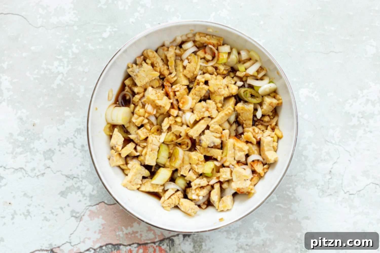 Zesty Lemongrass Tempeh with Sesame Noodles 5 Ingredients for our Lemongrass tempeh crumbles in a white bowl