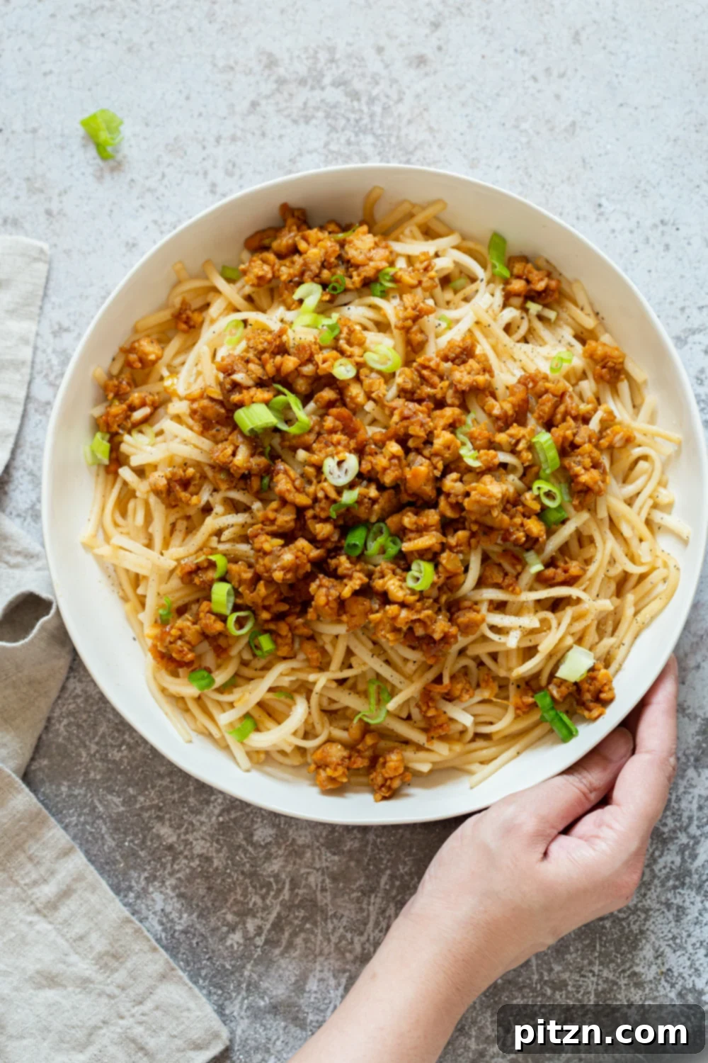 Zesty Lemongrass Tempeh with Sesame Noodles 9 Sesame Noodles with Lemongrass Tempeh Crumbles in a white bowl
