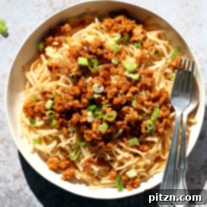Sesame Noodles with Lemongrass Tempeh Crumbles in a white bowl