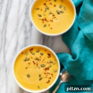 Our Creamy Vegan Pumpkin Apple Soup in white bowls