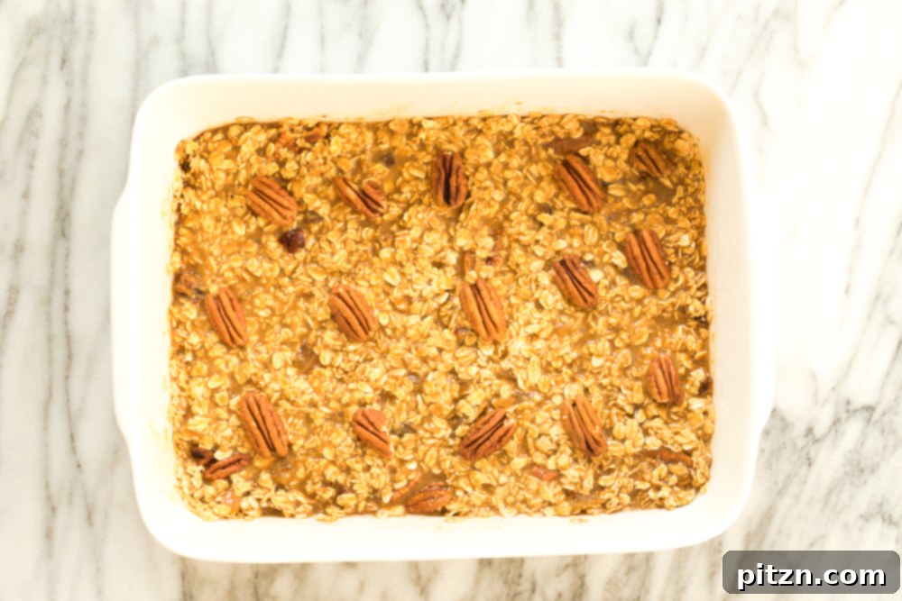 Oil-Free Vegan Gingerbread Oatmeal Delight 7 Vegan Gingerbread Baked Oatmeal in a white baking dish