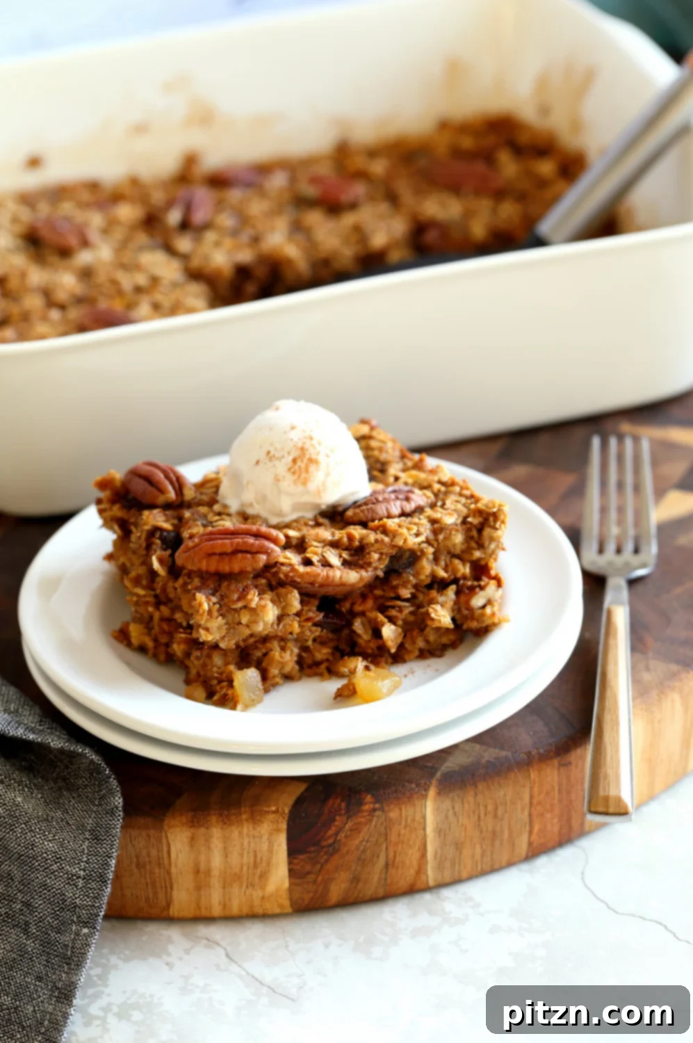Oil-Free Vegan Gingerbread Oatmeal Delight 9 Vegean gingerbread Baked Oatmeal slices on white plate