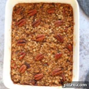 Vegan Gingerbread Baked Oatmeal in a white baking dish