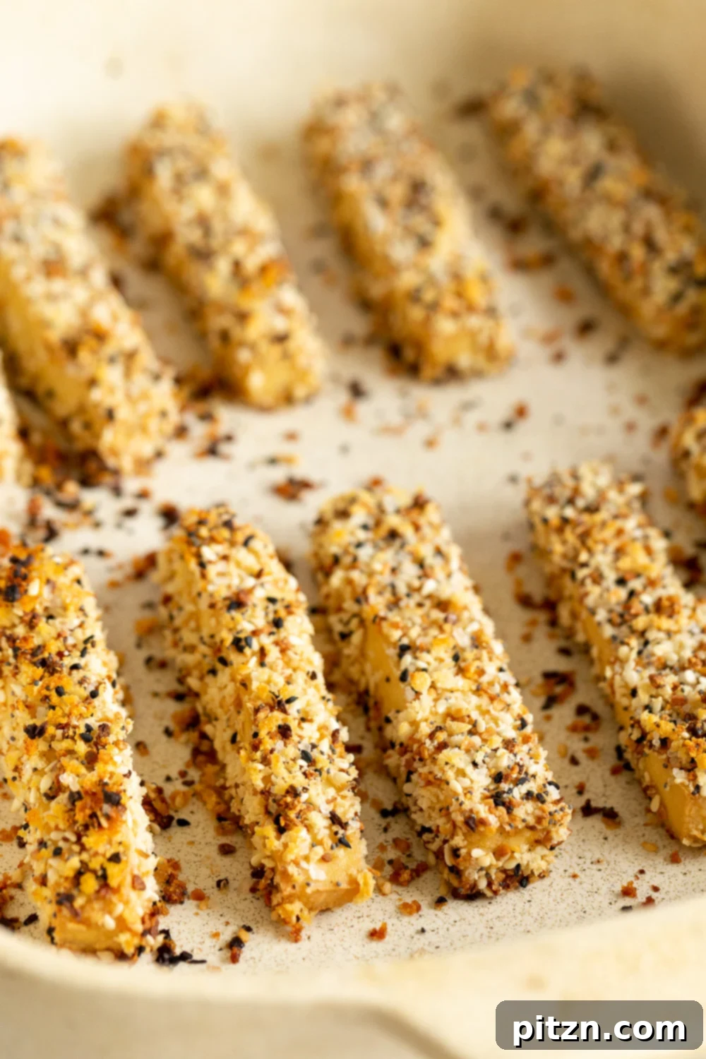 Crispy Everything Bagel Tofu 7 Close-up of a serving of Everything Bagel Tofu on a white and grey serving platter