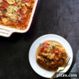 Our Vegan Gluten free Zucchini Lasagna in a cream baking dish and white plate