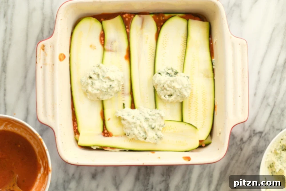 Creamy Vegan Gluten-Free Zucchini Lasagna with Tofu Ricotta 6 Layering Our Vegan Gluten free Zucchini Lasagna in a cream baking dish