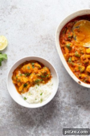 Vegan Cauliflower Pea Curry - 1 Pot Gobi Matar masala. This cauliflower peas curry gets baked in the oven. Creamy roasted flavors without standing around roasting the sauce. #Vegan #Glutenfree #Nutfree #Soyfree #Recipe #VeganRicha #gobimatar #cauliflowerpeacurry . Add some cooked chickpeas to make a meal