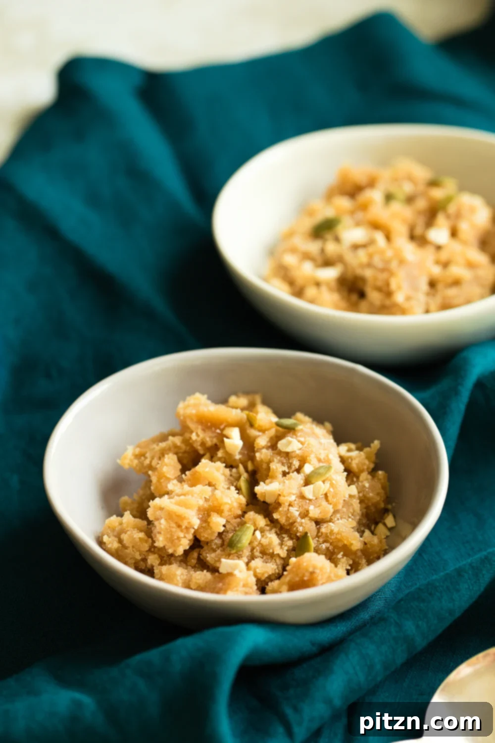 Vegan Almond Halwa - Instant Pot Badam Halwa in elegant white and grey bowls, garnished with nuts.