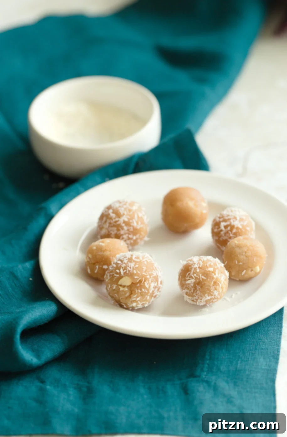 Vegan Almond Halwa shaped into festive almond ladoos, showcasing their versatile texture.
