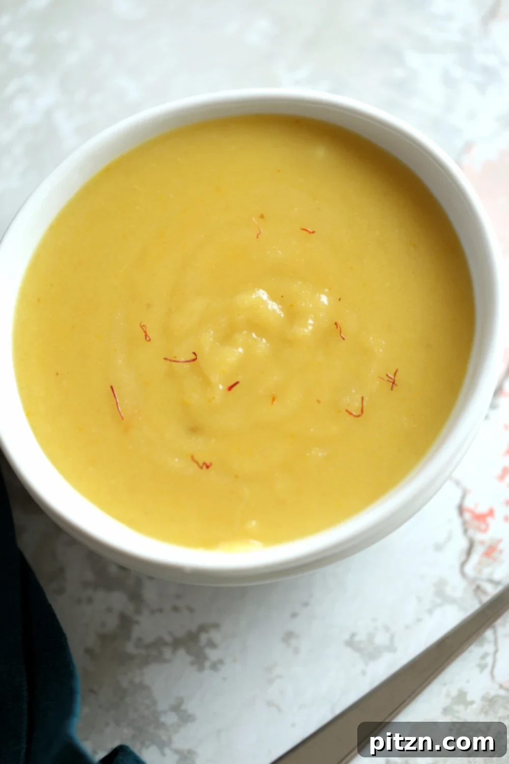 Rich Kesar Vegan Almond Halwa - Instant Pot Badam Halwa infused with saffron, served beautifully.