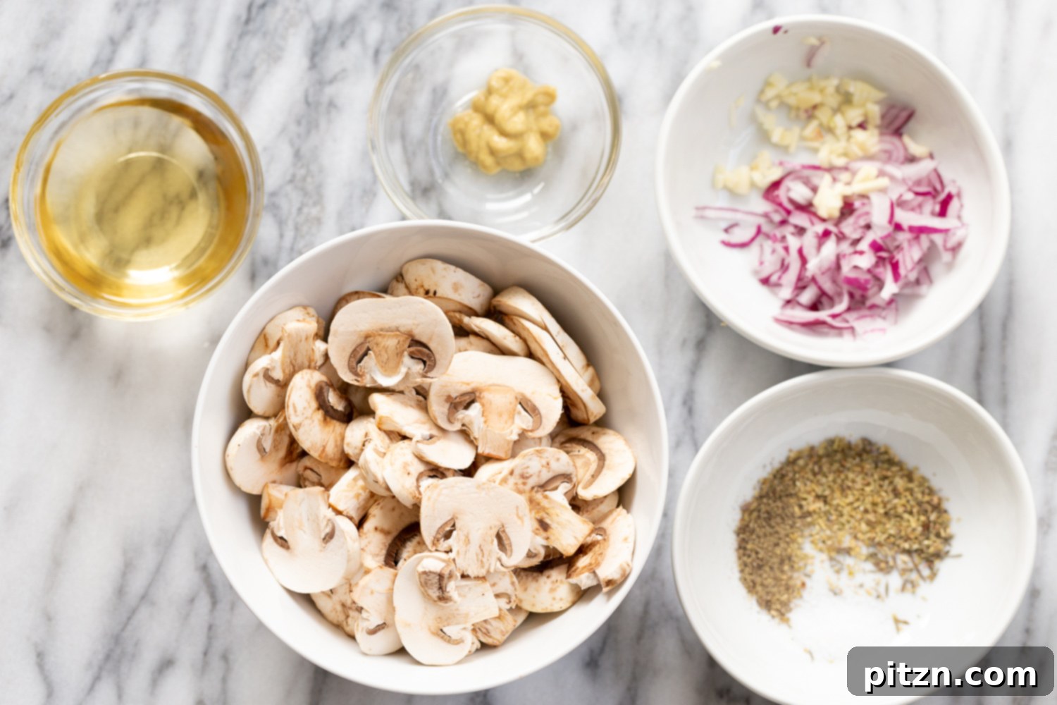 Ingredients for Vegan Mushroom Sauce laid out in white bowls